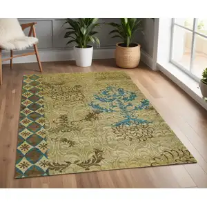 Photo of Tan Blue and Brown Floral Hand Knotted Area Rug