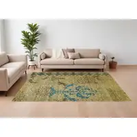 Photo of Tan Blue and Brown Floral Hand Knotted Area Rug