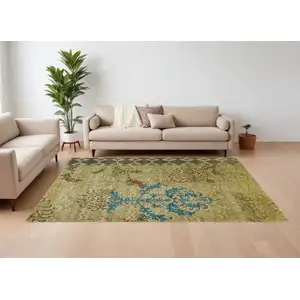 Photo of Tan Blue and Brown Floral Hand Knotted Area Rug