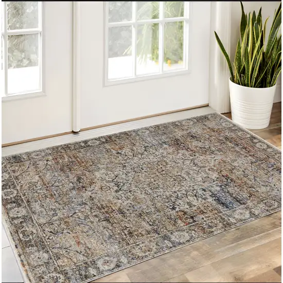 Tan Blue and Brown Oriental Power Loom Area Rug With Fringe Photo 1