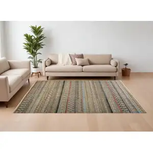 Photo of Tan Blue and Orange Striped Hand Knotted Area Rug