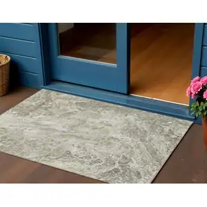 Photo of Tan Brown And Beige Abstract Washable Indoor Outdoor Area Rug