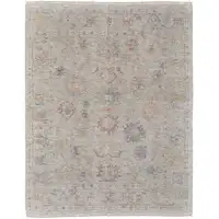 Photo of Tan Brown and Blue Floral Hand Woven Distressed Area Rug With Fringe