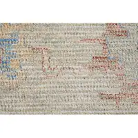 Photo of Tan Brown and Blue Floral Hand Woven Distressed Area Rug With Fringe