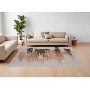 Photo of Tan Brown and Orange Abstract Hand Tufted Area Rug