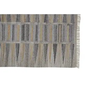 Photo of Tan Gray And Taupe Geometric Hand Woven Stain Resistant Area Rug With Fringe