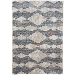 Photo of Tan Ivory And Blue Chevron Power Loom Stain Resistant Area Rug