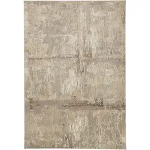 Photo of Tan Ivory And Brown Abstract Area Rug