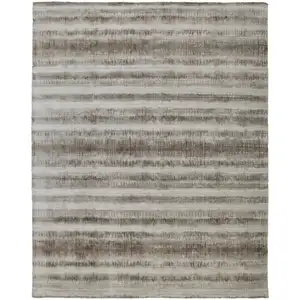 Photo of Tan Ivory And Brown Abstract Hand Woven Area Rug