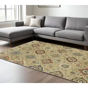 Photo of Tan Ivory And Brown Floral Area Rug With Fringe