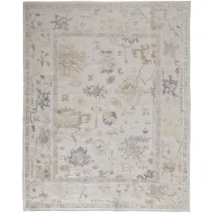 Photo of Tan Ivory And Orange Floral Hand Knotted Stain Resistant Area Rug