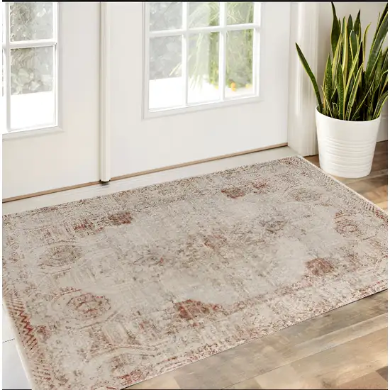 Tan Ivory And Orange Floral Power Loom Distressed Area Rug With Fringe Photo 2