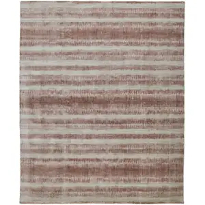 Photo of Tan Ivory And Pink Abstract Hand Woven Area Rug