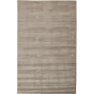 Photo of Tan Ivory And Taupe Hand Woven Area Rug