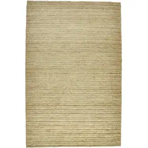 Photo of Tan Ivory And Taupe Hand Woven Area Rug