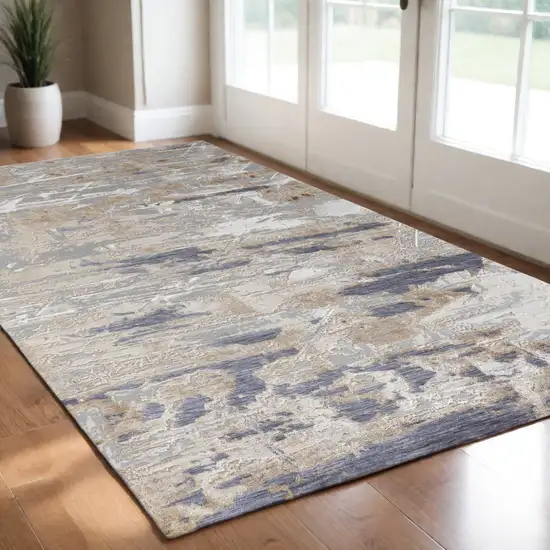 Tan Ivory and Blue Abstract Power Loom Worn Faded Area Rug Photo 1