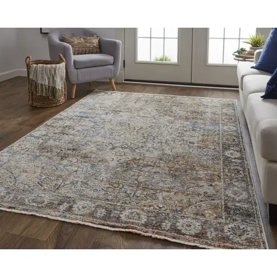 Tan Orange And Blue Floral Power Loom Distressed Area Rug With Fringe Photo 1