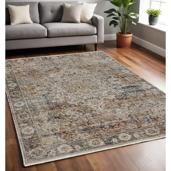 Tan and Blue Floral Power Loom Distressed Non Skid Area Rug With Fringe Photo 1