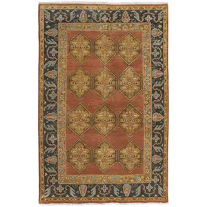 Photo of Tan Orange And Brown Wool Floral Hand Knotted Stain Resistant Area Rug