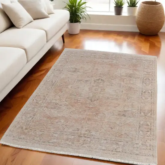 Tan Orange and Ivory Oriental Hand Woven Distressed Area Rug With Fringe Photo 1