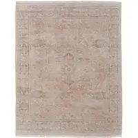 Photo of Tan Orange and Ivory Oriental Hand Woven Distressed Area Rug With Fringe