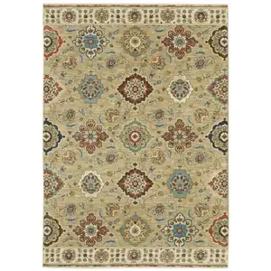 Photo of Tan Red And Blue Floral Area Rug With Fringe