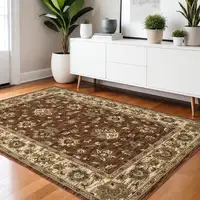 Photo of Tan Red And Ivory Floral Area Rug