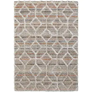 Photo of Tan Taupe And Ivory Geometric Power Loom Stain Resistant Area Rug