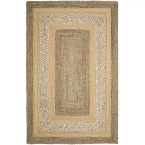 Photo of Tan and Beige Bordered Area Rug