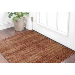 Photo of Tan and Brown Power Loom Area Rug