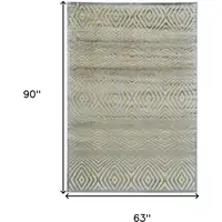 Photo of Tan and Gray Abstract Power Loom Area Rug