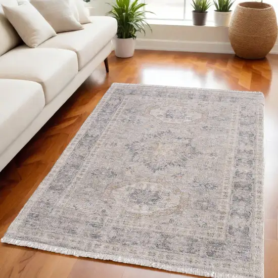 Tan and Gray Oriental Hand Woven Distressed Area Rug With Fringe Photo 1