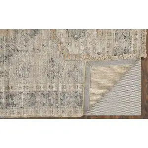 Photo of Tan and Gray Oriental Hand Woven Distressed Area Rug With Fringe