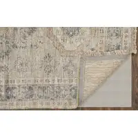 Photo of Tan and Gray Oriental Hand Woven Distressed Area Rug With Fringe