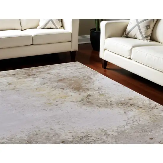 Tan and Ivory Abstract Power Loom Worn Faded Area Rug Photo 1