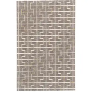 Photo of Tan and Ivory Geometric Hand Woven Area Rug