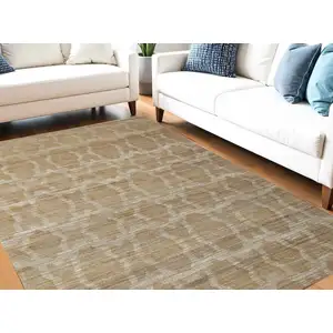 Photo of Tan and Ivory Geometric Hand Woven Area Rug