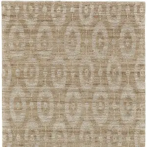 Photo of Tan and Ivory Geometric Hand Woven Area Rug