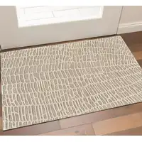 Photo of Tan and Ivory Wool Abstract Hand Tufted Area Rug