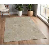 Photo of Tan and Ivory Wool Floral Hand Knotted Area Rug