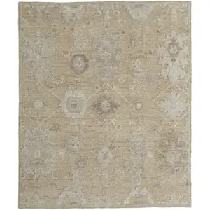 Photo of Tan and Ivory Wool Floral Hand Knotted Area Rug