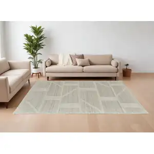 Photo of Tan and Ivory Wool Geometric Hand Woven Area Rug