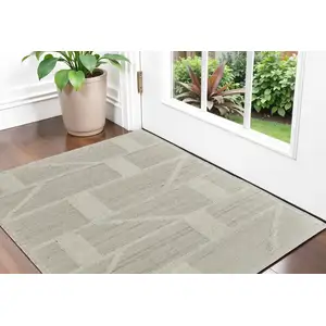 Photo of Tan and Ivory Wool Geometric Hand Woven Area Rug