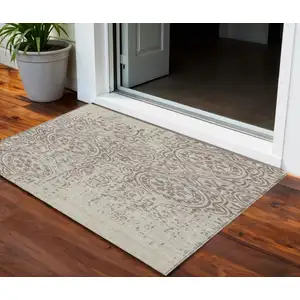 Photo of Taupe And Beige Medallion Washable Indoor Outdoor Area Rug