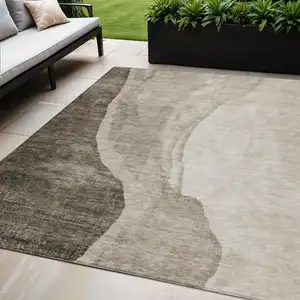 Photo of Taupe And Brown Abstract Washable Indoor Outdoor Area Rug