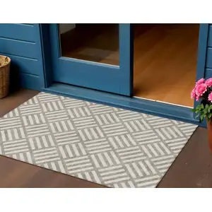 Photo of Taupe And Ivory Geometric Washable Indoor Outdoor Area Rug