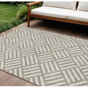 Photo of Taupe And Ivory Geometric Washable Indoor Outdoor Area Rug