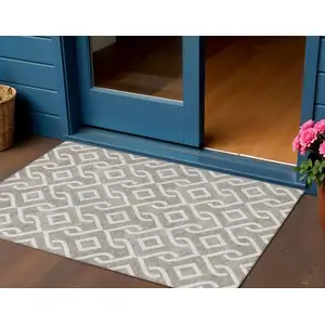 Photo of Taupe And Ivory Geometric Washable Indoor Outdoor Area Rug