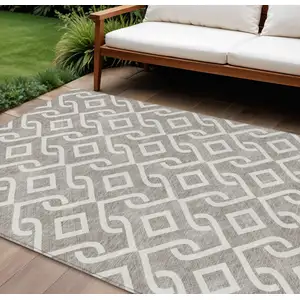 Photo of Taupe And Ivory Geometric Washable Indoor Outdoor Area Rug