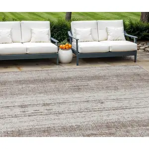 Photo of Taupe And Ivory Striped Washable Indoor Outdoor Area Rug